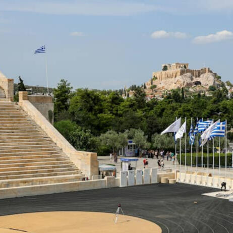 Panathenaic Stadium in Athens with the Acropolis in the background, performance coaching story by Coach Siskos