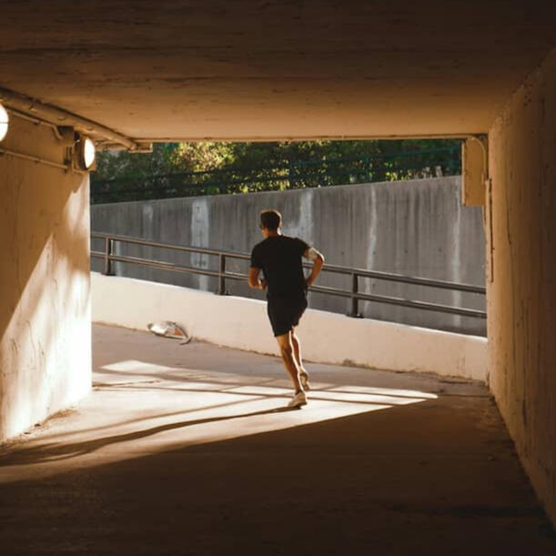 Focus Program Athlete running through a tunnel toward the light, performance coaching mindset story by Coach Siskos